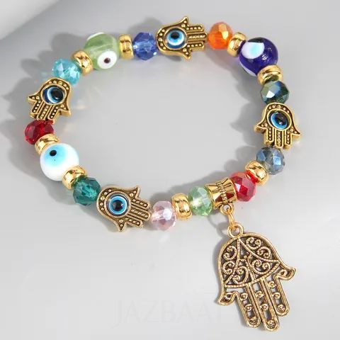 Colorful beaded bracelet with Hamsa hand charms on a light gray background